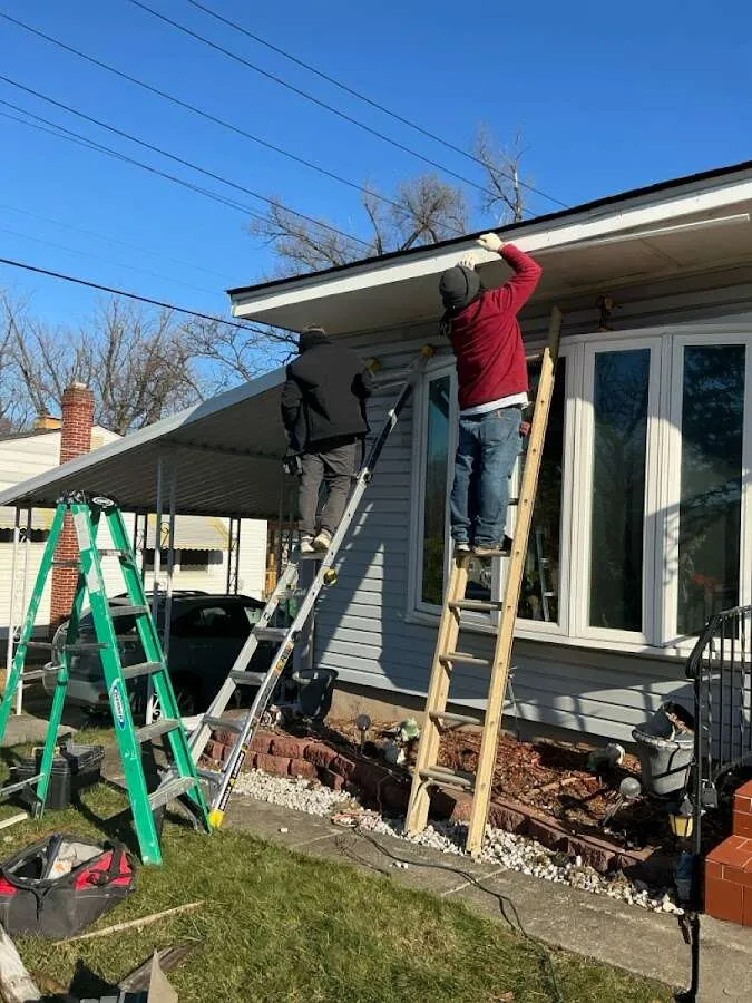Restoration crew performing exterior repair in New Burlington