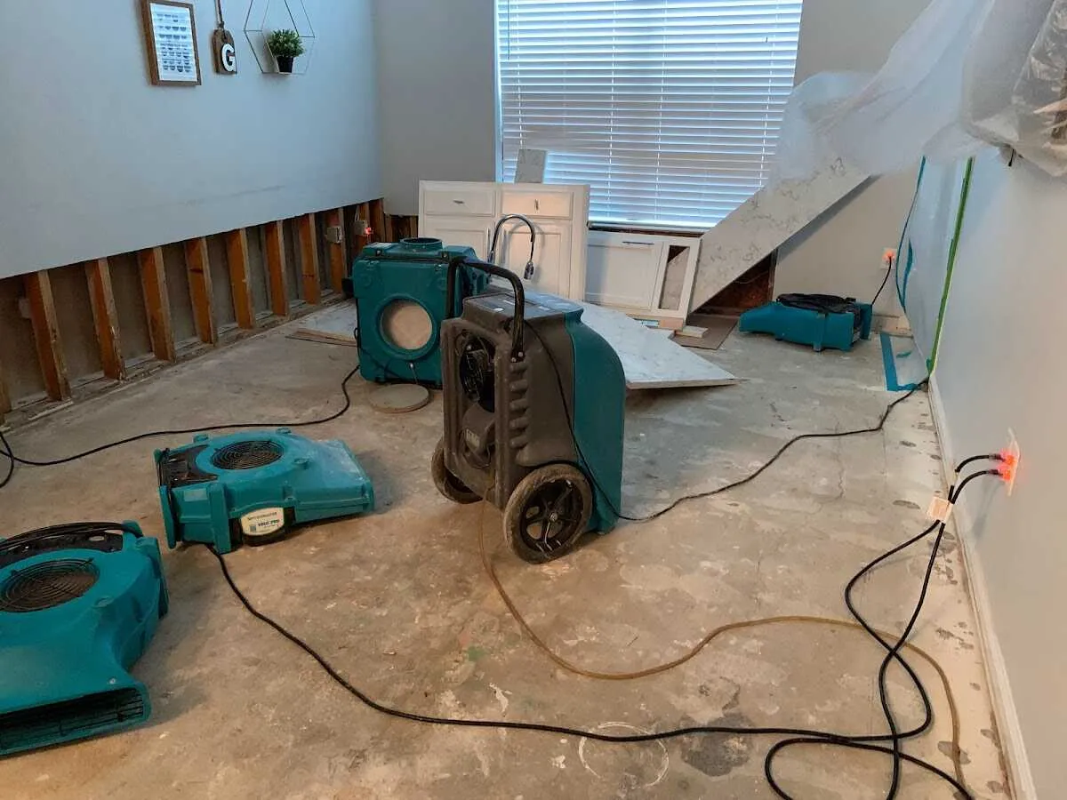 Dehumidifier in flood-cut room for Water Damage Restoration in New Burlington